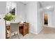 Bright office space with wooden desk and chair, perfect for remote work or studying with a window for natural light at 14944 E Archer Cir, Aurora, CO 80012