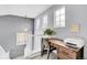 Bright office nook with built in desk and chair rail on second story landing at 14944 E Archer Cir, Aurora, CO 80012