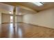 Spacious basement features wood-look floors and a door to the outside at 9784 W Euclid Dr, Littleton, CO 80123