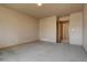 Neutral bedroom featuring carpet, and view of an open closet at 9784 W Euclid Dr, Littleton, CO 80123