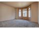 Bright bedroom with carpet and a large bay window to provide plenty of natural light at 9784 W Euclid Dr, Littleton, CO 80123