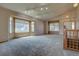 Open living room featuring vaulted ceilings, lots of natural light from multiple windows, and neutral wall colors at 9784 W Euclid Dr, Littleton, CO 80123