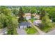 A home with a backyard featuring an expansive lot with mature trees, a storage shed, and off-street parking at 8450 W 13Th St, Lakewood, CO 80215