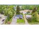 Charming home featuring well-manicured front lawn, gravel driveway, and a stepping stone path to a cozy porch entry at 8450 W 13Th St, Lakewood, CO 80215