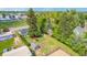 Expansive backyard featuring garden beds, a shed, mature trees and a red umbrella seating area at 8450 W 13Th St, Lakewood, CO 80215