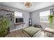 A well-lit bedroom with shelves, stylish lighting, and a comfortable bed at 8450 W 13Th St, Lakewood, CO 80215