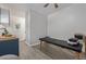 Bonus room with modern vinyl flooring, exam table, and kitchenette with a window at 8450 W 13Th St, Lakewood, CO 80215