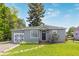 Charming single Gathering home featuring a well-manicured lawn and delightful curb appeal at 8450 W 13Th St, Lakewood, CO 80215