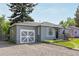 Charming single Gathering home featuring a well-manicured lawn and delightful curb appeal at 8450 W 13Th St, Lakewood, CO 80215