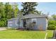 Charming single Gathering home featuring a well-manicured lawn and delightful curb appeal at 8450 W 13Th St, Lakewood, CO 80215