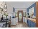 Bright kitchen featuring blue cabinetry, butcher block countertops, and stylish fixtures at 8450 W 13Th St, Lakewood, CO 80215