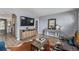 Comfortable living room featuring stylish furnishings, wood-look floors, and lots of natural light at 8450 W 13Th St, Lakewood, CO 80215