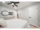 Modern bedroom featuring hardwood floors, modern fan, and updated lighting at 1243 Monroe St, Denver, CO 80206