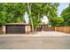 This home has a two-car garage and a private driveway. Mature landscaping provides privacy at 1243 Monroe St, Denver, CO 80206