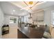Modern kitchen with stainless steel appliances, gray cabinetry, and dark countertops at 1243 Monroe St, Denver, CO 80206
