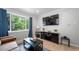 Bright living room featuring hardwood floors, contemporary furnishings, and natural light at 1243 Monroe St, Denver, CO 80206