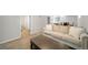 Spacious finished basement features an inviting, neutral sofa and carpeted flooring at 1243 Monroe St, Denver, CO 80206