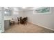 Finished basement has table seating and access to a kitchen area with bar seating at 1243 Monroe St, Denver, CO 80206
