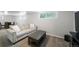 Spacious finished basement features an inviting, neutral sofa and carpeted flooring at 1243 Monroe St, Denver, CO 80206