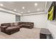 Spacious finished basement featuring recessed lighting and a large, comfortable sectional sofa at 9162 W Unser Ave, Littleton, CO 80128