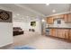 Finished basement with kitchenette, dart board, and entertainment area with a television at 9162 W Unser Ave, Littleton, CO 80128