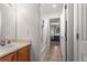 Bathroom with vanity sink, tile floors, and adjacent bathtub and shower combination at 9162 W Unser Ave, Littleton, CO 80128