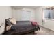 Bedroom with a full-sized bed, neutral decor, and natural light from the window at 9162 W Unser Ave, Littleton, CO 80128