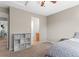 Comfortable bedroom with adjoining bathroom and built in storage shelves at 9162 W Unser Ave, Littleton, CO 80128