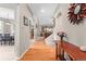 Inviting foyer with hardwood floors, arched doorways, and a view of the staircase at 9162 W Unser Ave, Littleton, CO 80128