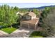 Beautiful two-story home with a stone facade, two-car garage, and well-manicured front lawn at 9162 W Unser Ave, Littleton, CO 80128