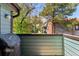 Balcony view with a Traeger grill surrounded by lush greenery and neighborhood scenery at 11905 E Harvard Ave # 208, Aurora, CO 80014