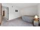 Bright bedroom features neutral carpet, fresh paint, and ample natural light at 11905 E Harvard Ave # 208, Aurora, CO 80014