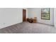 A spacious bedroom featuring neutral carpet and white walls providing a blank canvas at 11905 E Harvard Ave # 208, Aurora, CO 80014