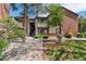 A charming two-story condo with well-maintained landscaping is surrounded by lush foliage at 11905 E Harvard Ave # 208, Aurora, CO 80014