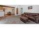 Open-concept living space with a dining area, exposed wood beams and comfortable seating at 11905 E Harvard Ave # 208, Aurora, CO 80014