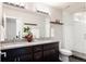 Bathroom with double vanity and large walk-in shower at 1576 W Maple Ave, Denver, CO 80223