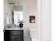 Modern bathroom with granite vanity and updated fixtures at 1576 W Maple Ave, Denver, CO 80223