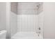 Clean bathroom with a bathtub and tiled shower at 1576 W Maple Ave, Denver, CO 80223