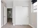 Bedroom with carpet and sliding door closet at 1576 W Maple Ave, Denver, CO 80223