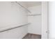 Walk-in closet with ample shelving and hanging space at 1576 W Maple Ave, Denver, CO 80223