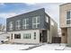 Modern two-story home with gray siding and brick accents at 1576 W Maple Ave, Denver, CO 80223