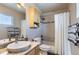 Well-lit bathroom featuring a shower-tub combination with a white shower curtain and granite countertop at 4137 Clifton Ct, Boulder, CO 80301