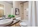 Bright bathroom featuring a shower-tub combination with a white shower curtain, vanity and artwork at 4137 Clifton Ct, Boulder, CO 80301