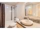 Modern bathroom featuring shower-tub combination with neutral tiling, and a neutral colored vanity at 4137 Clifton Ct, Boulder, CO 80301