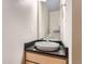 Powder room with a modern vessel sink and dark granite countertop at 4137 Clifton Ct, Boulder, CO 80301