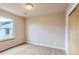 Cozy carpeted bedroom with a large window bringing in natural light, and access to closet at 4137 Clifton Ct, Boulder, CO 80301