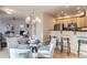 Bright dining area with a glass-top table and modern chandelier at 4137 Clifton Ct, Boulder, CO 80301