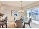 Bright dining area with a modern chandelier and sliding glass doors leading to outdoor space at 4137 Clifton Ct, Boulder, CO 80301