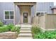 Exterior view of a home's entrance with a covered porch and well-maintained landscaping at 4137 Clifton Ct, Boulder, CO 80301