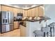 Well-equipped kitchen featuring stainless steel appliances and bar-style seating at 4137 Clifton Ct, Boulder, CO 80301